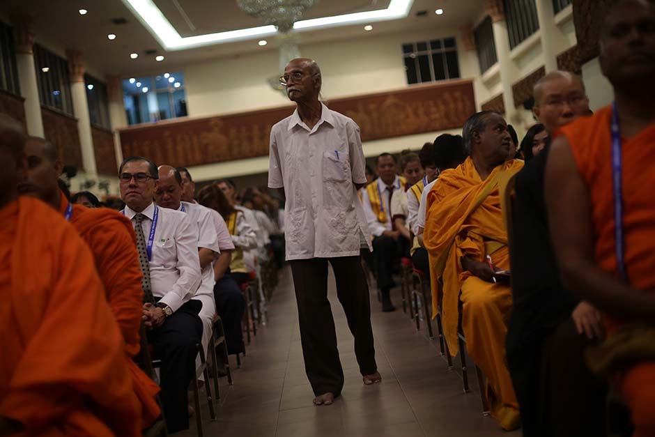 KUALA LUMPUR , 31/3/2014 . A man standing in the hall prayer during prayer for passengers onboard missing Malaysia Airlines (MAS) flight MH370 at Buddhist Maha Vihara, Brickfields Kuala Lumpur.AWANI / SHAHIR OMAR