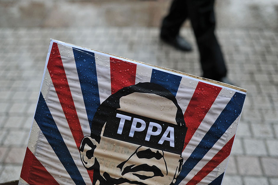KUALA LUMPUR ,  26/4/2014 .Poster of of United States America President, Barack Obama during protest of The Trans Pacific Partnership Agreement ( TPPA ) followed by Obama visit into Malaysia.Obama is scheduled to arrive in Malaysia on April 26, after visiting Japan, South Korea and the Philippines. AWANI / SHAHIR OMAR