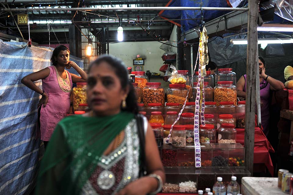 KUALA LUMPUR , 5/4/2014 .A hawker standing in her shop during Ugadi festival books in Brickfields Kuala Lumpur.Ugadi is the New Year's Day for the people of the Deccan region of India.Its begins with the month of Chaitra (March ,April). AWANI / SHAHIR OMAR