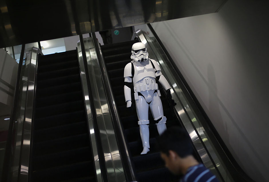 SHAH ALAM , 4/5/2014. A person dress as Stormtroopers in Star Wars characters goes down an escalator during Star Wars Day, May fourth with members of the 501 st Legion at Raja Tun Uda libary Shah Alam. AWANI / SHAHIR OMAR