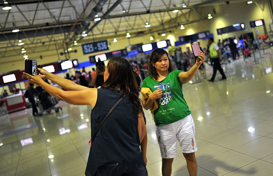 KUALA LUMPUR , 8/5/2014.Visitors taking their picture himself at Low Cost Carrier Terminal (LCCT) Sepang. On this night LCCT will be last operation and Air Asia will beginning their operation in KLIA2 start on Friday. AWANI / SHAHIR OMAR